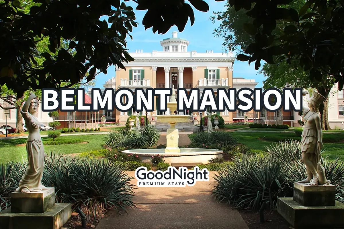 The elegant Belmont Mansion framed by manicured gardens, a central fountain, and statues, inviting visitors to stroll and relax. The lush greenery and stately architecture create a peaceful yet distinguished outdoor environment.