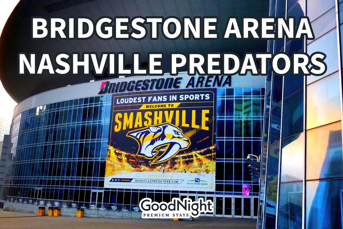 This exterior shot highlights the prominent Bridgestone Arena signage, the Nashville Predators logo, and a banner welcoming visitors to 'Smashville.' It captures the atmosphere of sports, concerts, and community events happening at this iconic venue.